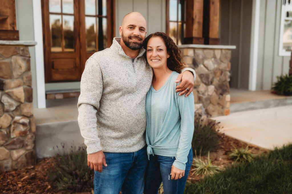 Couple embraces for Family Photos in Asheville, NC.