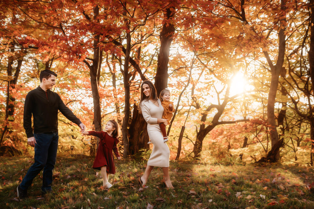 Family walks along together in autumn for Family Photoshoot in Asheville, NC.