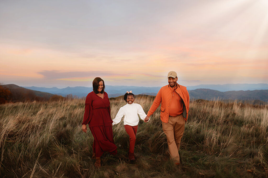 Family walks together during Family Portrait Session at Max Patch.