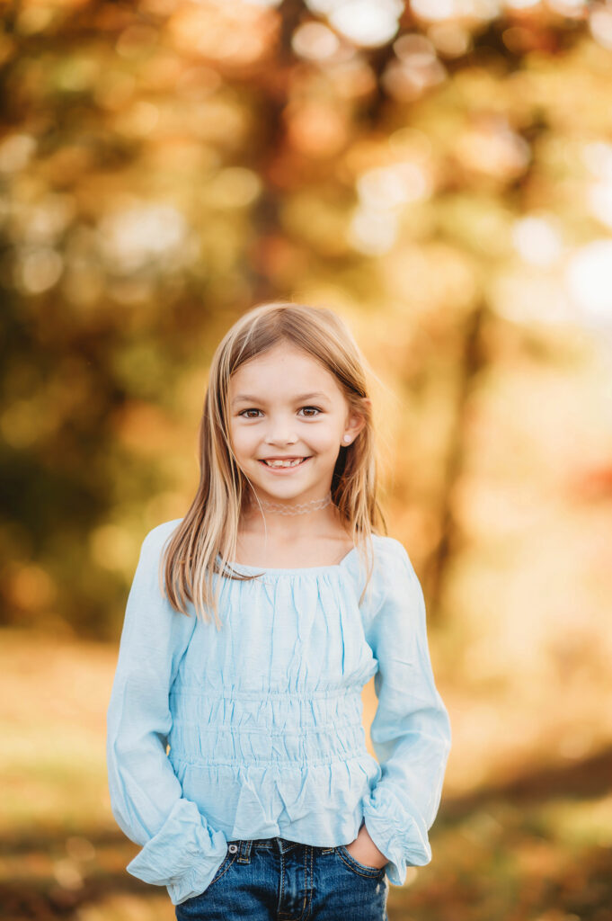 Little girl smiles at the camera during Family Photoshoot in Asheville.