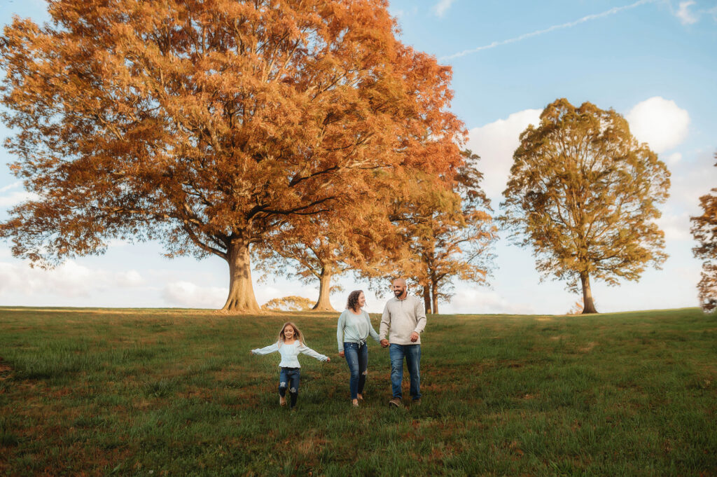 Family walks together during their fall family photoshoot in Asheville, NC