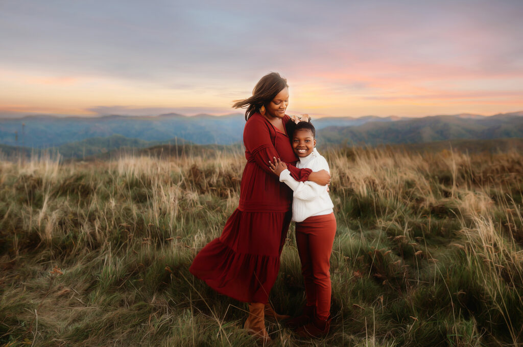 Mother embraces her daughter during Family Photoshoot in Asheville, NC.