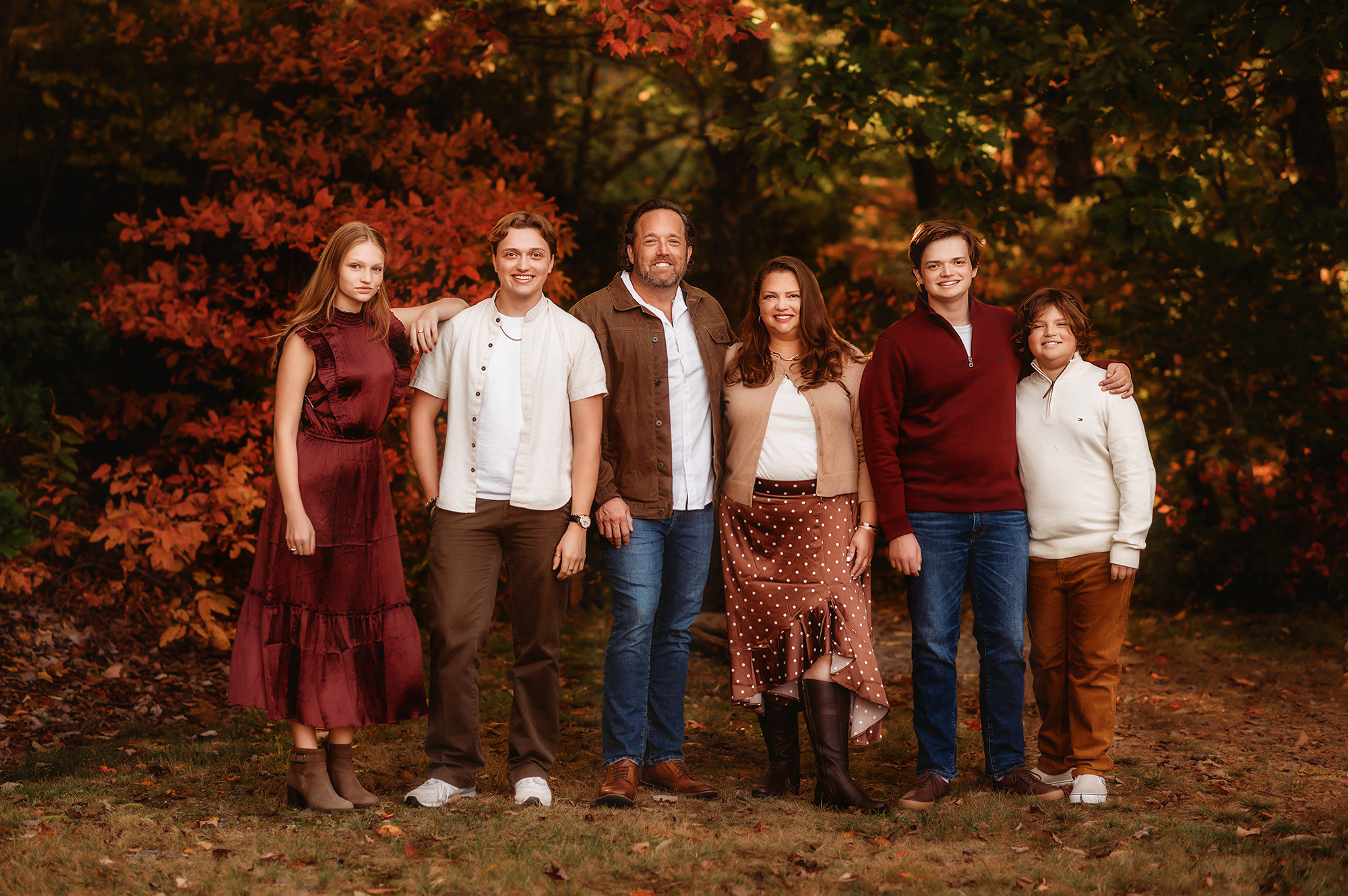 Family poses for Fall Photos in Asheville, NC.