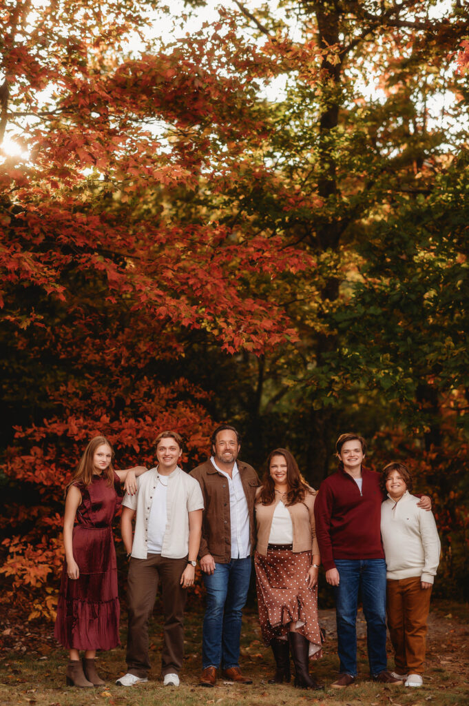 Family poses for Fall Family Photos in Asheville, NC.