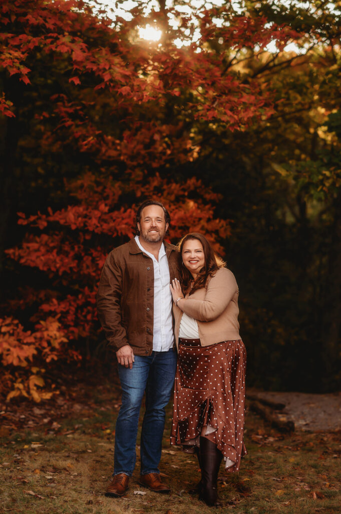 Family poses for Fall Family Photos in Asheville, NC.