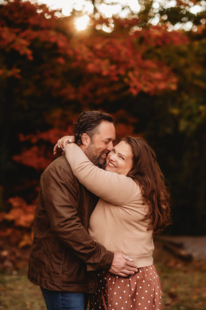 Family poses for Fall Family Photos in Asheville, NC.