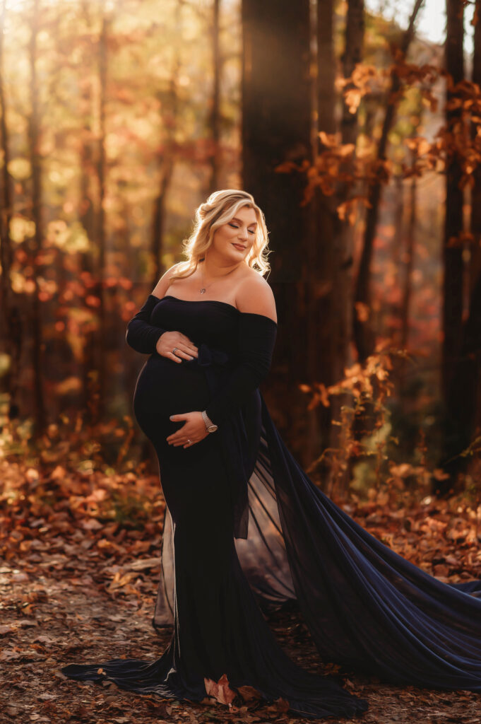 Pregnant woman poses for Maternity Portraits on the Blue Ridge Parkway in Asheville, NC.