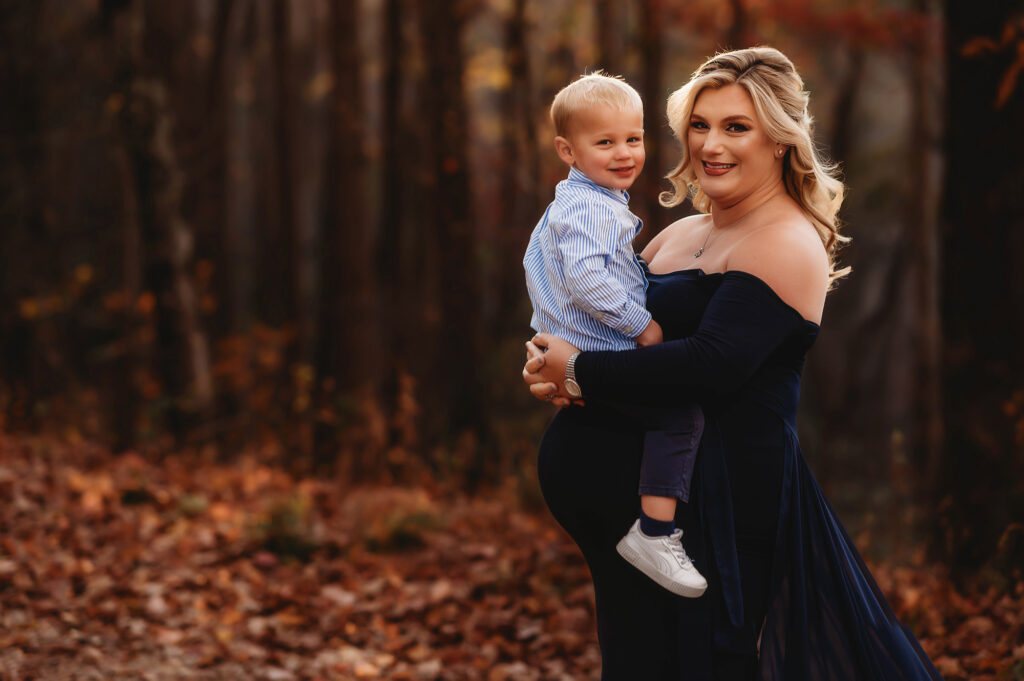 Pregnant mother embraces her toddler during Portrait Session.