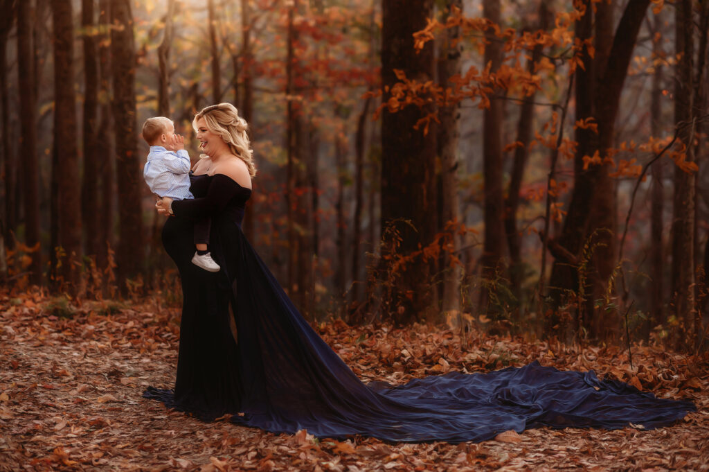 Expectant mother holds her toddler during Maternity Portrait Session in Asheville, NC.