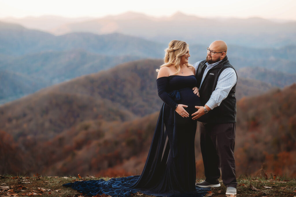 Husband and wife embrace during Maternity Portrait Session in Asheville. 