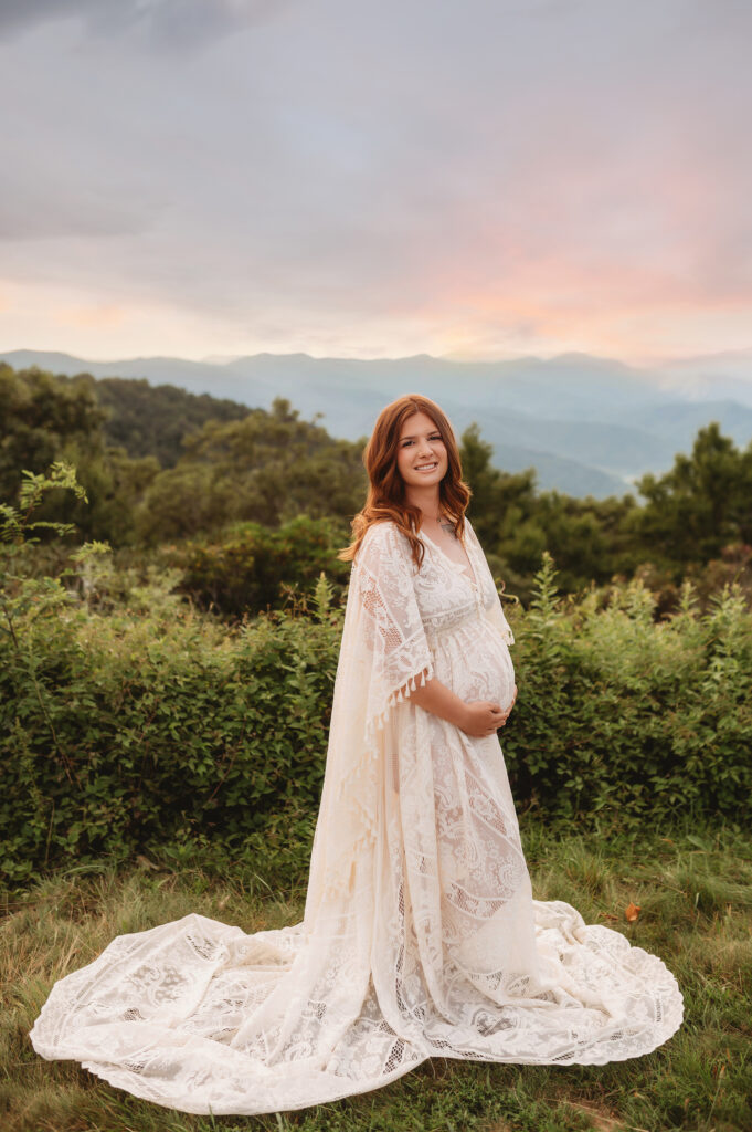 Expectant parents pose for Maternity Photos on the Blue Ridge Parkway in Asheville, NC after learning about the Top 5 things every pregnant woman should experience in Asheville.