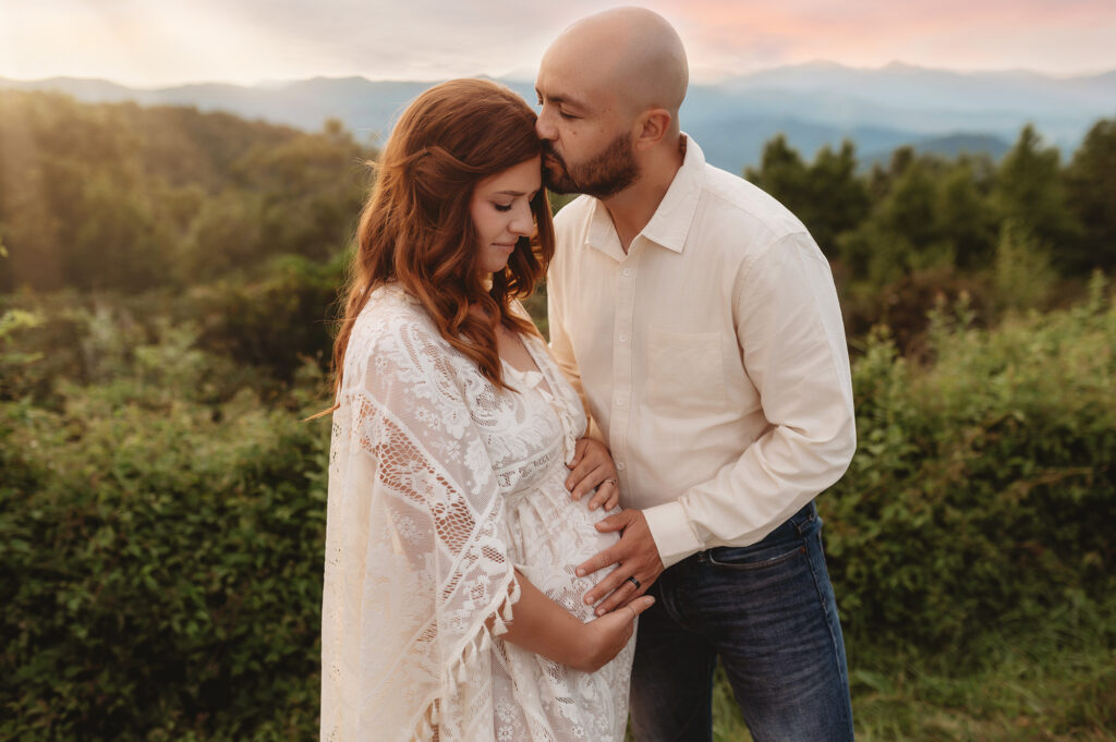 Expectant parents pose for Maternity Photos on the Blue Ridge Parkway in Asheville, NC after learning about the 5 Fun Things Pregnant Women Should Experience in Asheville.