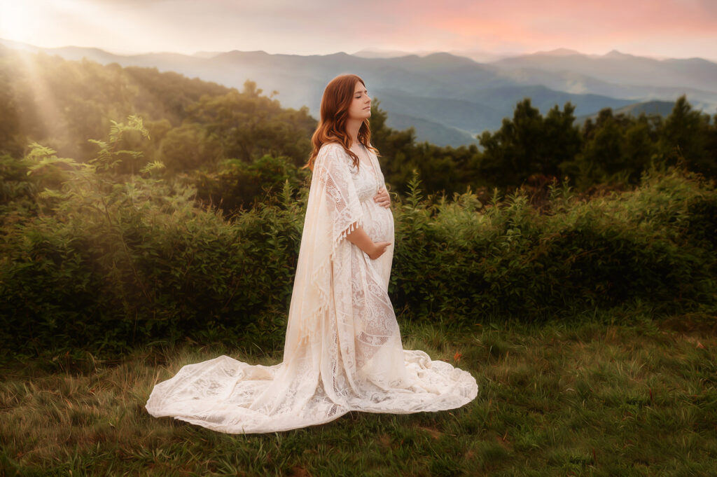 Pregnant woman poses for Maternity Photos on the Blue Ridge Parkway in Asheville, NC.