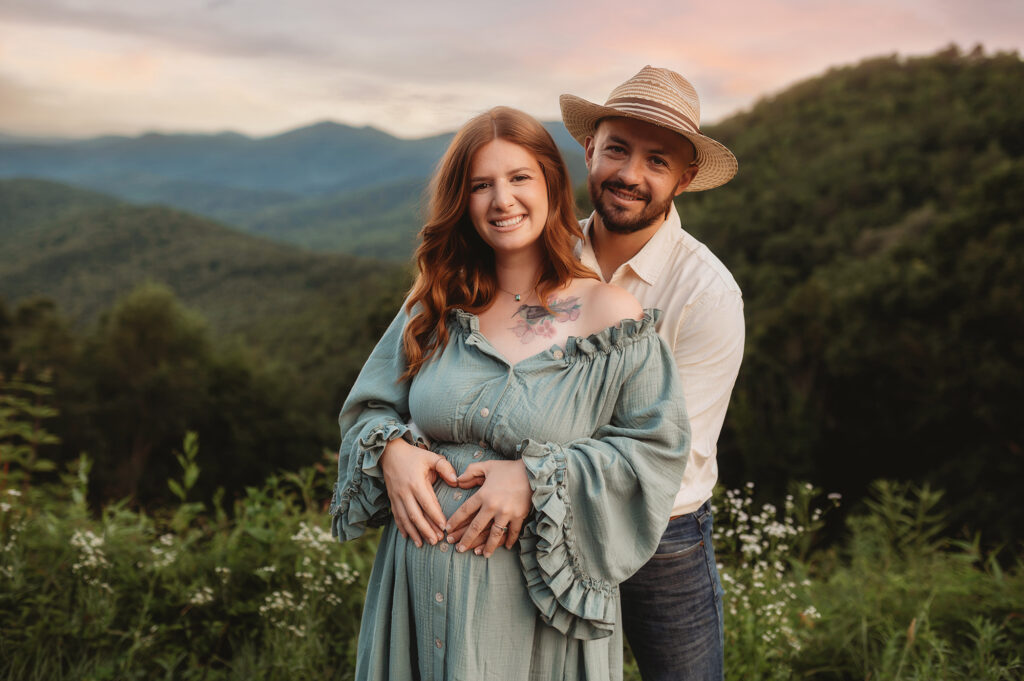 Expectant parents pose for Maternity Photos in Asheville, NC.